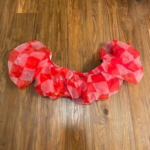 Tube top, lots of frills. Red and pink checkered. Size S